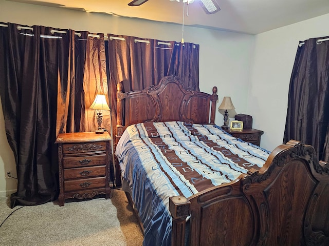 bedroom with ceiling fan and carpet