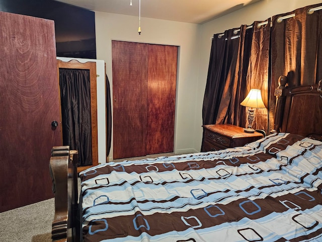 carpeted bedroom with a closet