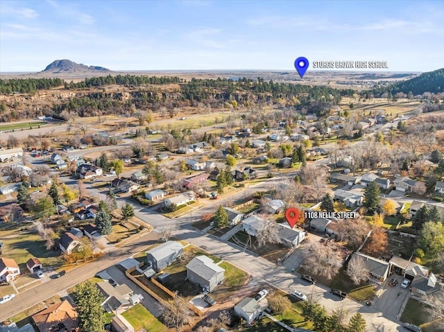 birds eye view of property with a mountain view