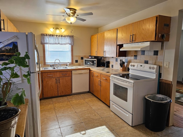 kitchen with ceiling fan, sink, white appliances, decorative backsplash, and light tile patterned floors