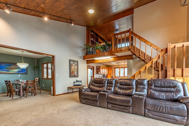 home theater room featuring wooden ceiling and track lighting