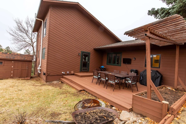 back of property with a pergola, a storage unit, and a wooden deck