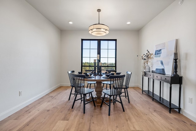 dining space with light wood-type flooring