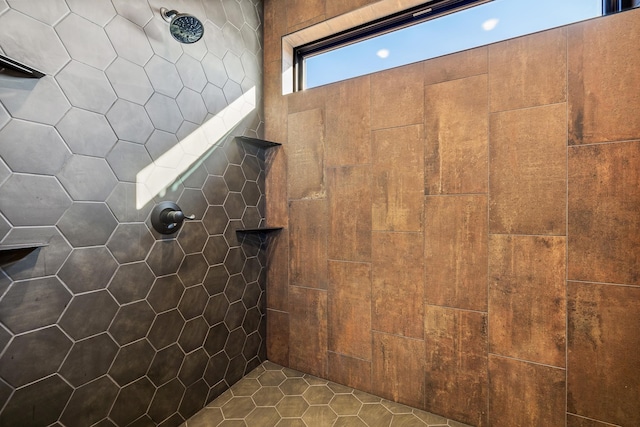 bathroom with a tile shower