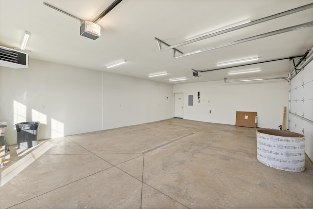 garage with electric panel and a garage door opener