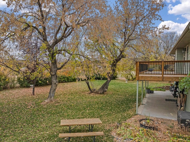 view of yard with a wooden deck