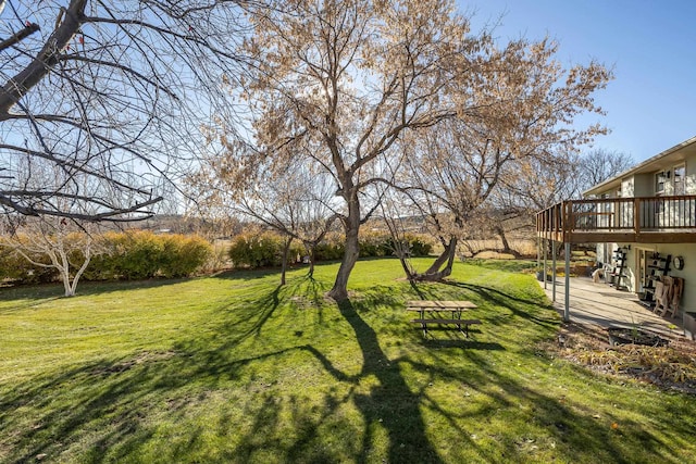 view of yard featuring a wooden deck