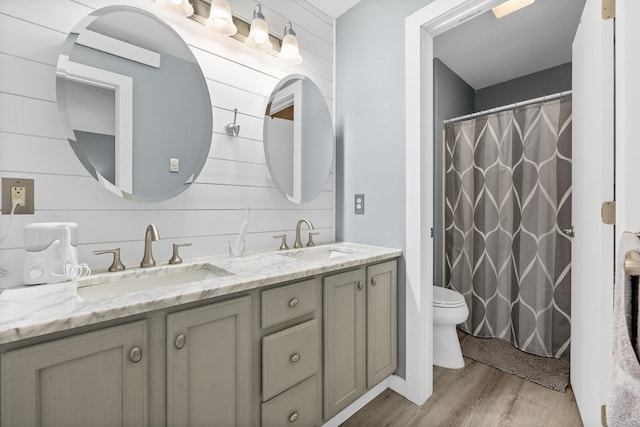 bathroom featuring vanity, hardwood / wood-style flooring, a shower with shower curtain, toilet, and tasteful backsplash