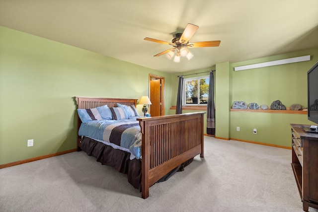 bedroom featuring ceiling fan and light carpet