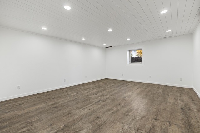 basement with dark hardwood / wood-style flooring and wood ceiling