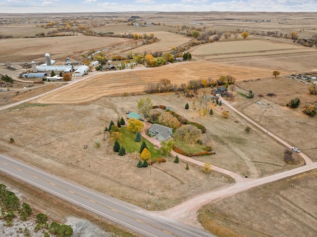 birds eye view of property featuring a rural view