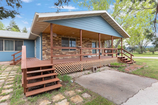 back of house featuring a wooden deck