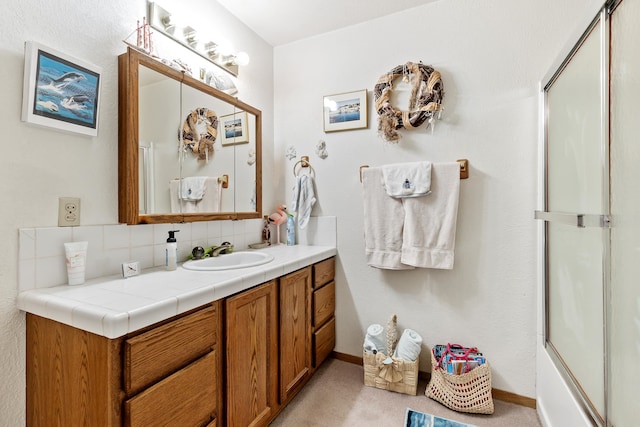 bathroom with vanity and backsplash