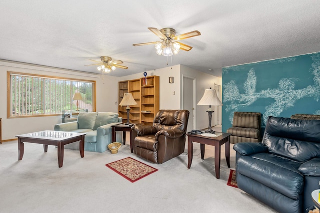 carpeted living room with a textured ceiling and ceiling fan