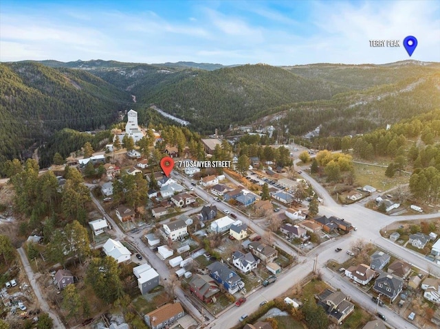 birds eye view of property featuring a mountain view