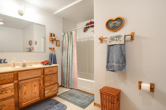 bathroom with shower / bath combo and vanity