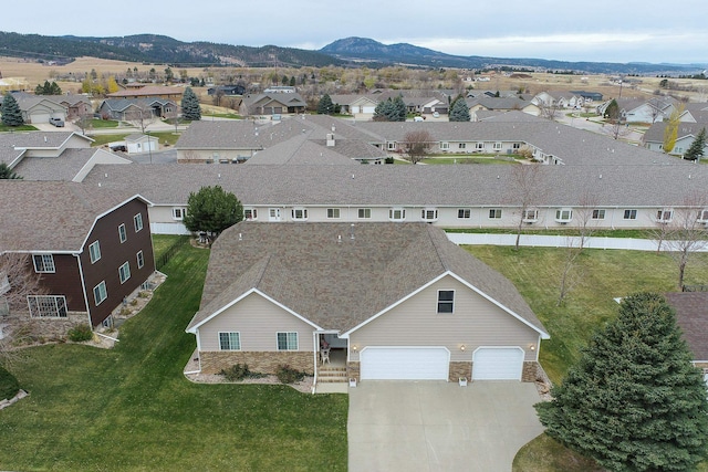 drone / aerial view featuring a mountain view