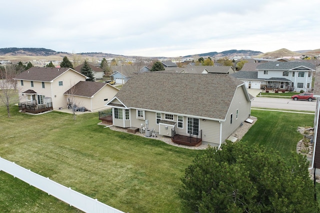 birds eye view of property featuring a mountain view