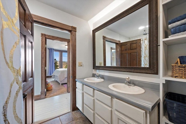 bathroom featuring tile patterned flooring and vanity