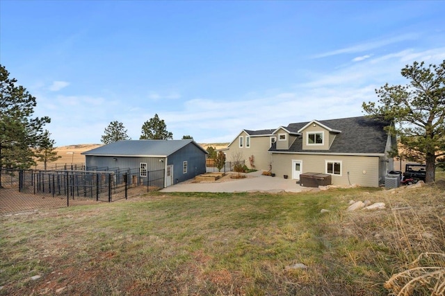 rear view of house featuring a lawn