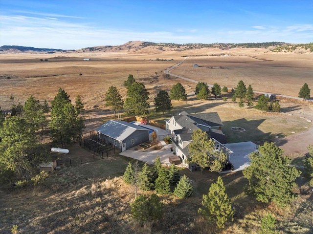 birds eye view of property with a mountain view and a rural view