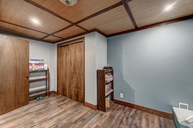 additional living space with hardwood / wood-style floors and wood ceiling