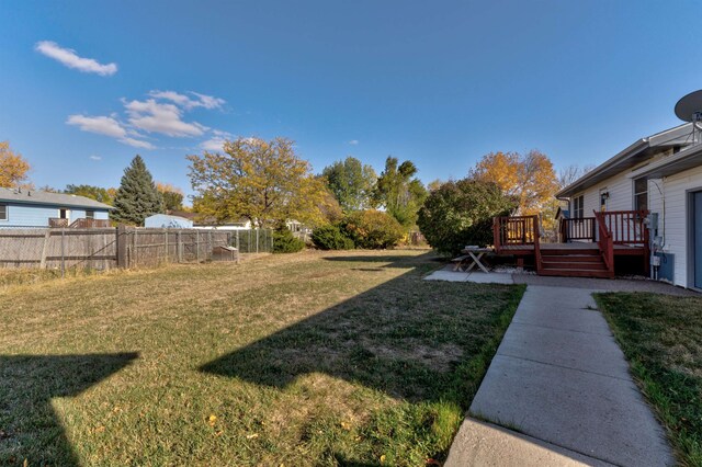 view of yard with a deck