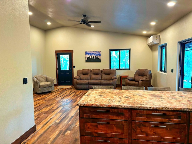 living room featuring a wall mounted air conditioner, dark hardwood / wood-style floors, ceiling fan, and lofted ceiling