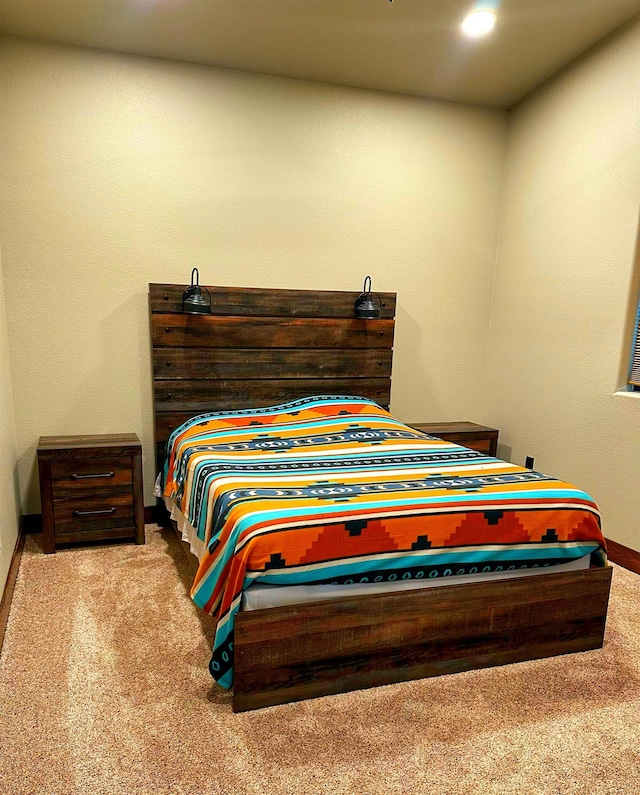 bedroom featuring light carpet