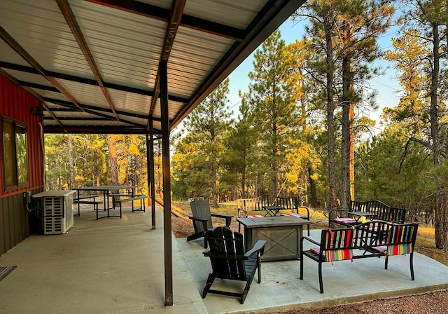 view of patio / terrace with an outdoor fire pit