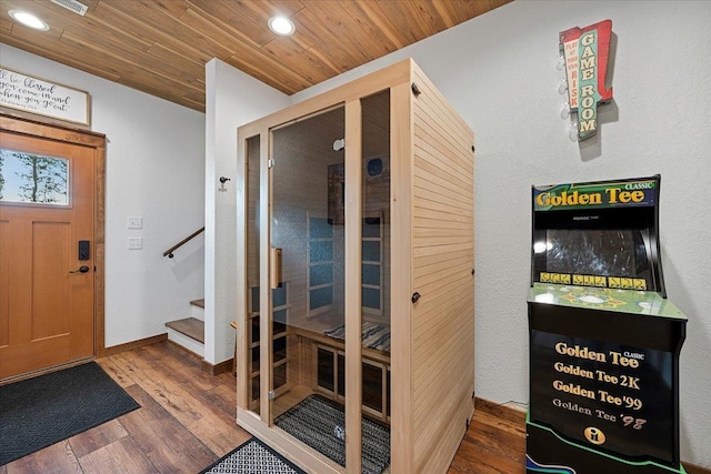 entrance foyer with hardwood / wood-style flooring and wooden ceiling