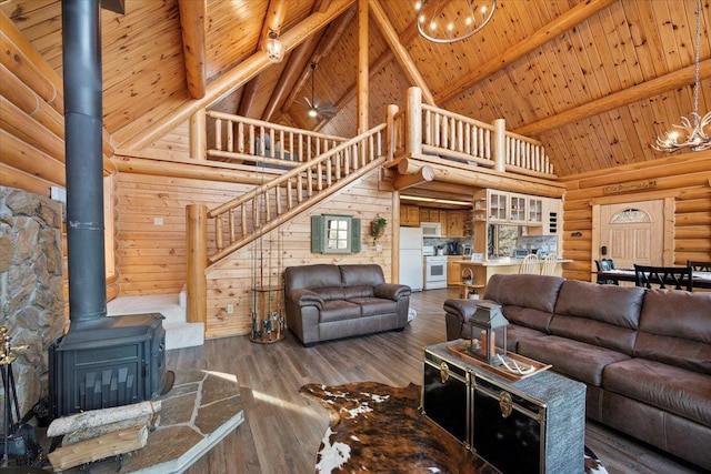 living room with wooden ceiling, high vaulted ceiling, beam ceiling, dark hardwood / wood-style flooring, and a chandelier