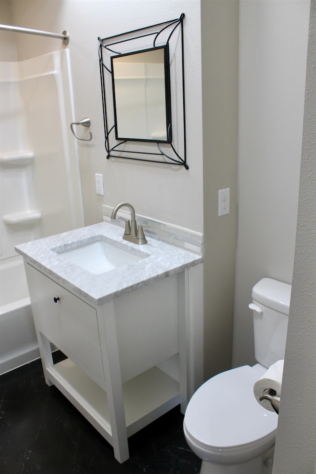 full bathroom with vanity, toilet, and  shower combination