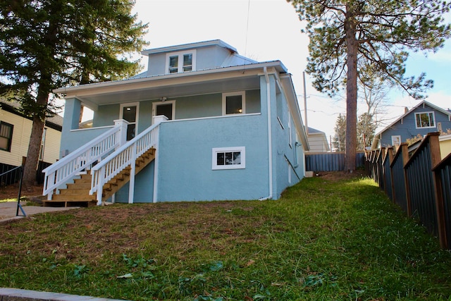 bungalow-style house with a front lawn