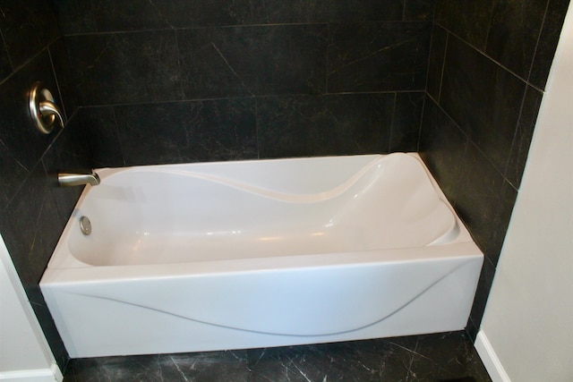 bathroom featuring a tub to relax in