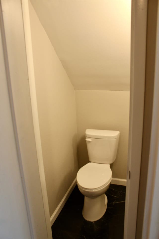 bathroom featuring tile patterned flooring and toilet