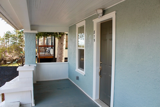 entrance to property with a porch