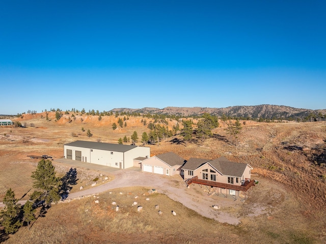 drone / aerial view featuring a mountain view