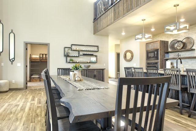 dining space featuring light hardwood / wood-style floors