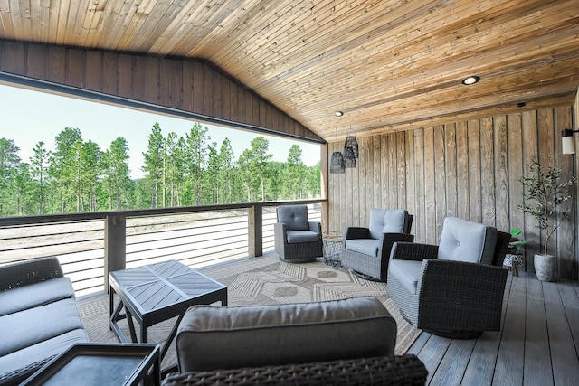 wooden deck with an outdoor living space