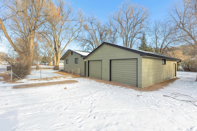 view of snow covered garage