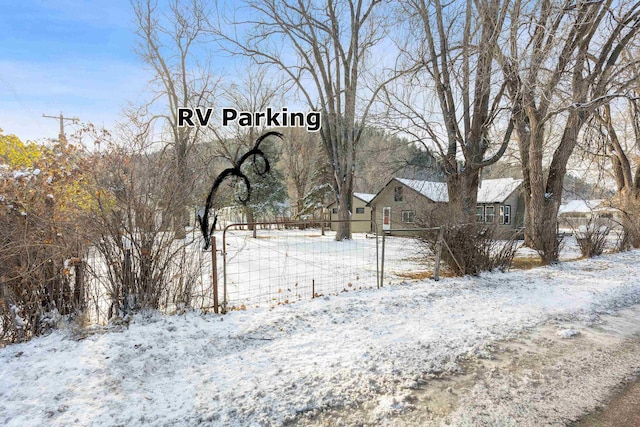 view of yard covered in snow