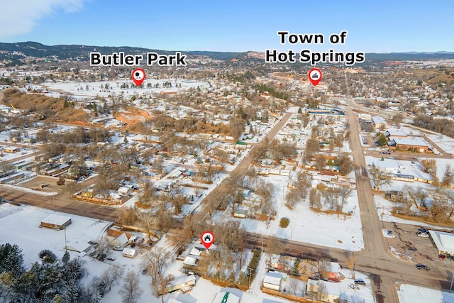 snowy aerial view with a mountain view