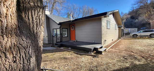 view of home's exterior featuring a deck