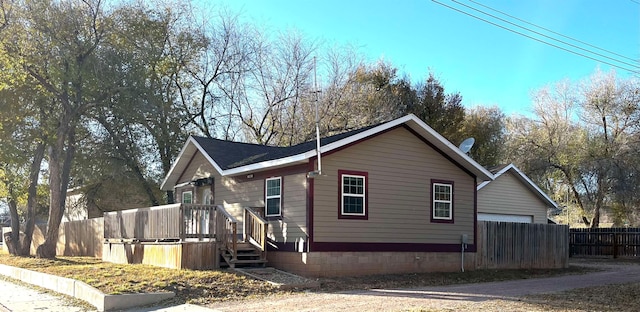 view of home's exterior featuring a wooden deck