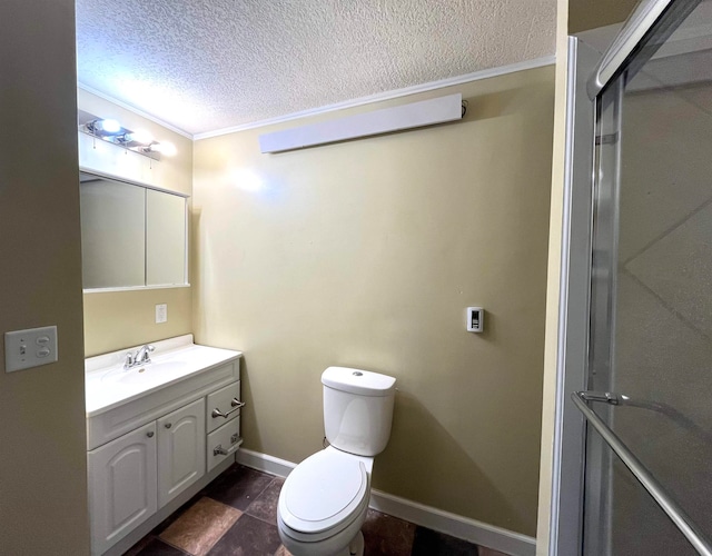 bathroom with ornamental molding, vanity, a textured ceiling, a shower with door, and toilet