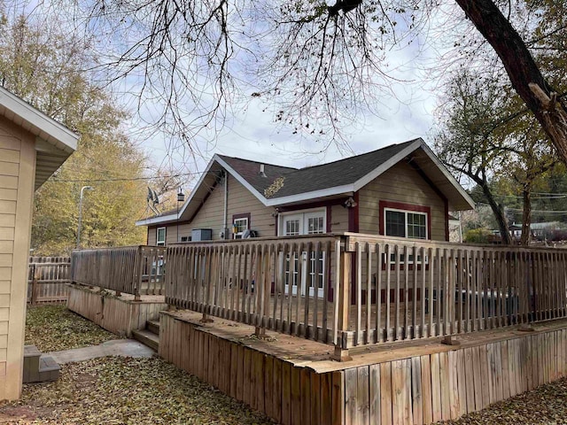 back of property featuring a deck