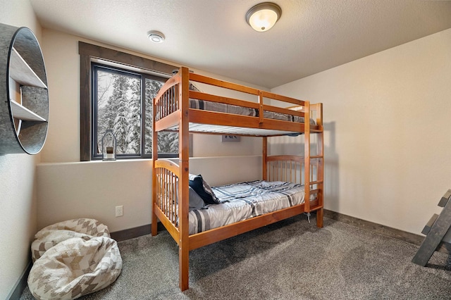 carpeted bedroom featuring a textured ceiling