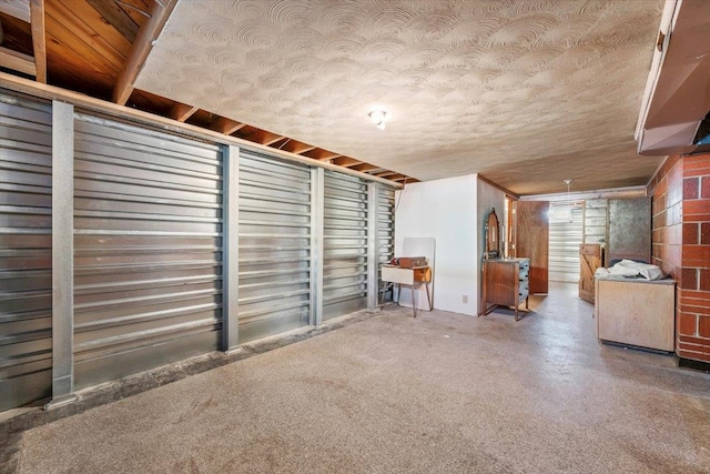 basement featuring a textured ceiling