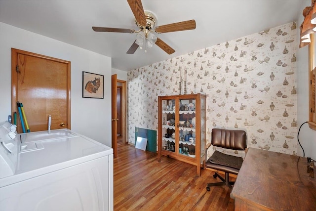 laundry area with washer and dryer, ceiling fan, and light hardwood / wood-style floors